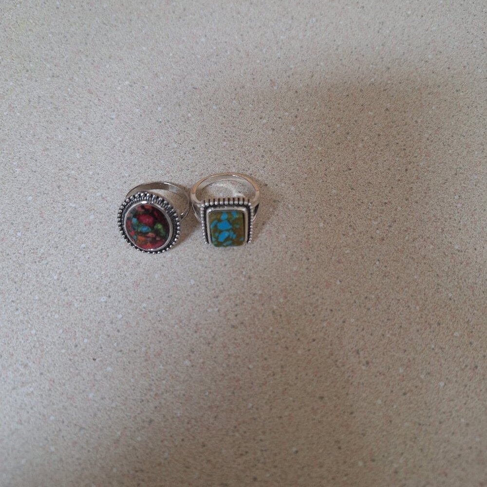 TWO FASHION RINGS.